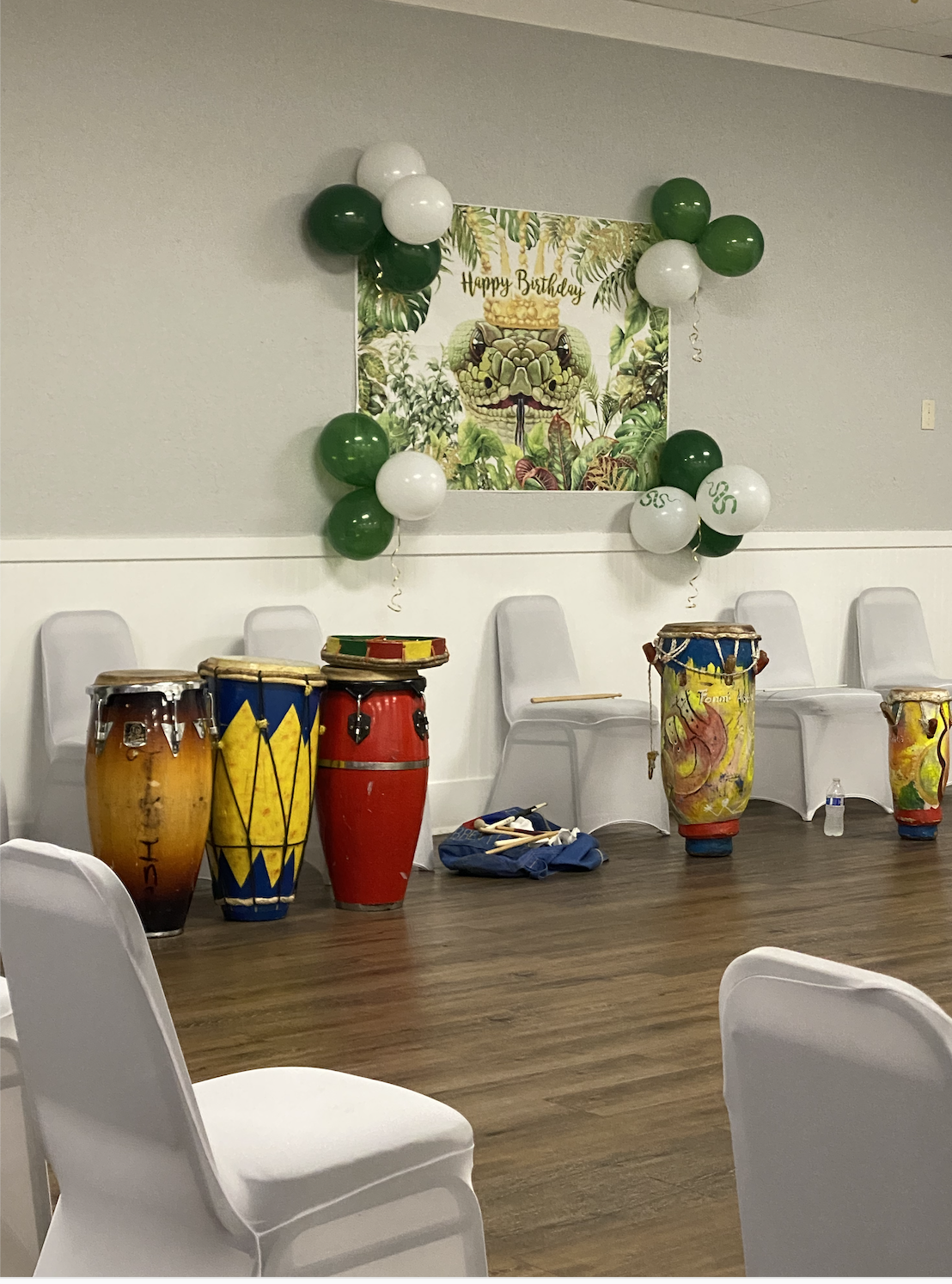 Traditional Haitian drums arranged indoors for a cultural gathering