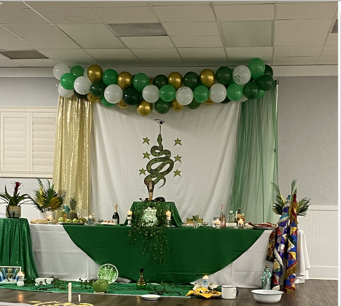 Green altar with candles and ceremonial display